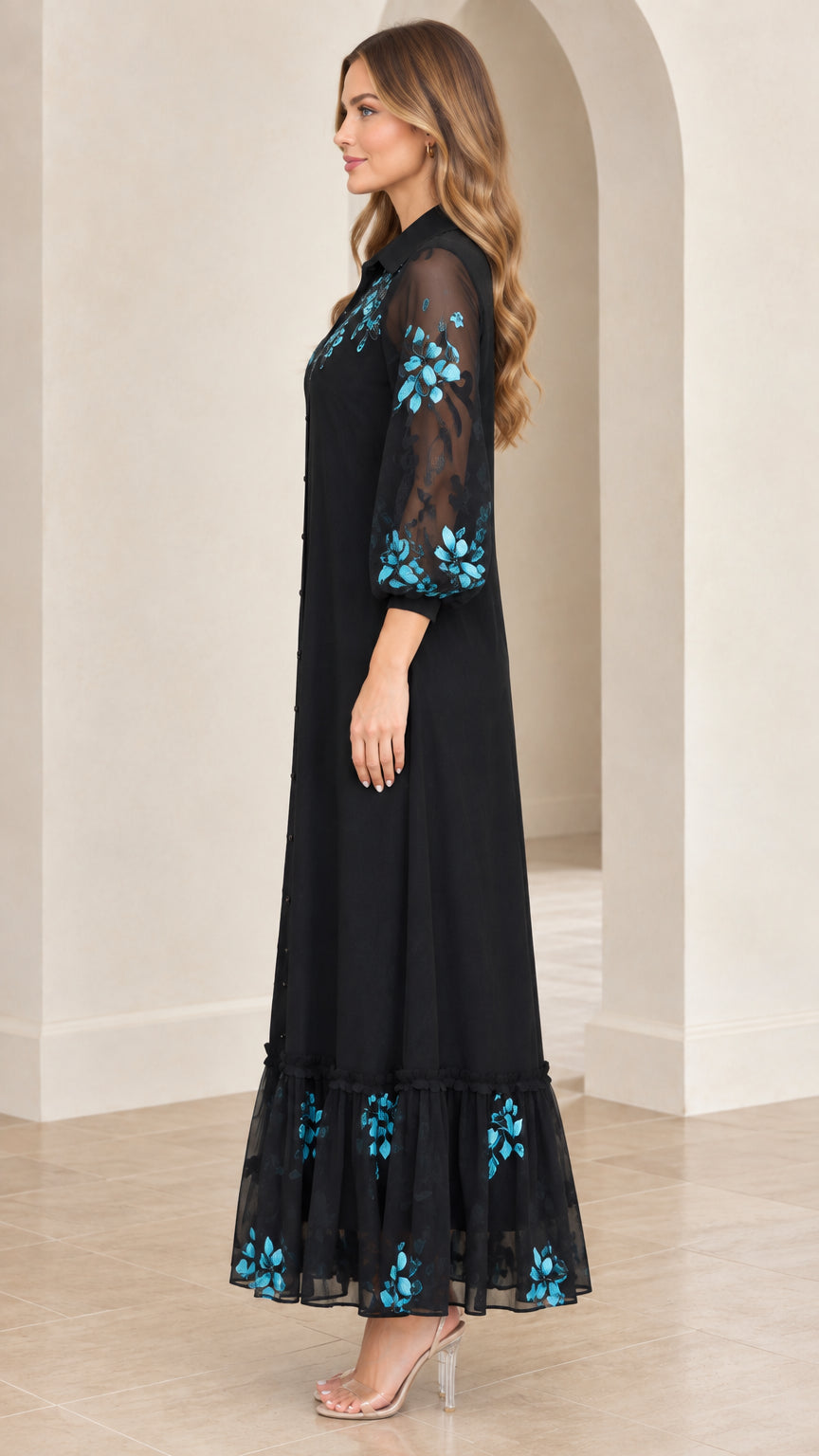 Side angle of model wearing black embroidered button-front maxi shirt dress