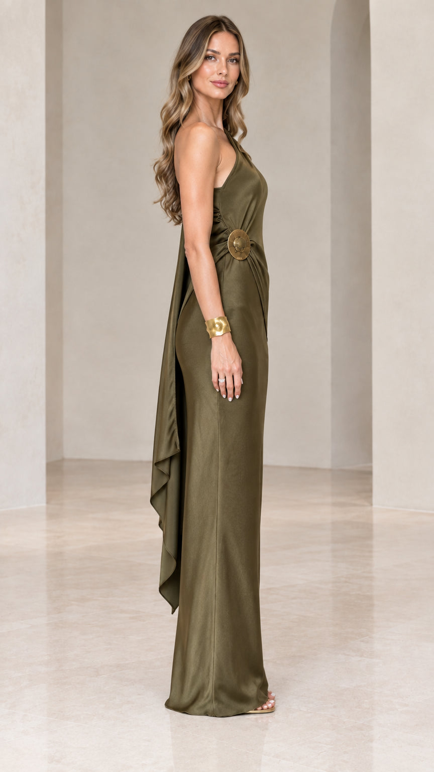 Side profile of olive green one-shoulder satin evening gown showing waist detail