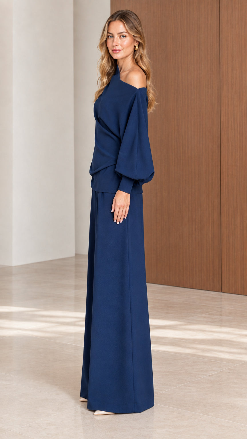 Side view of model wearing Navy Blue draped one-shoulder pant set