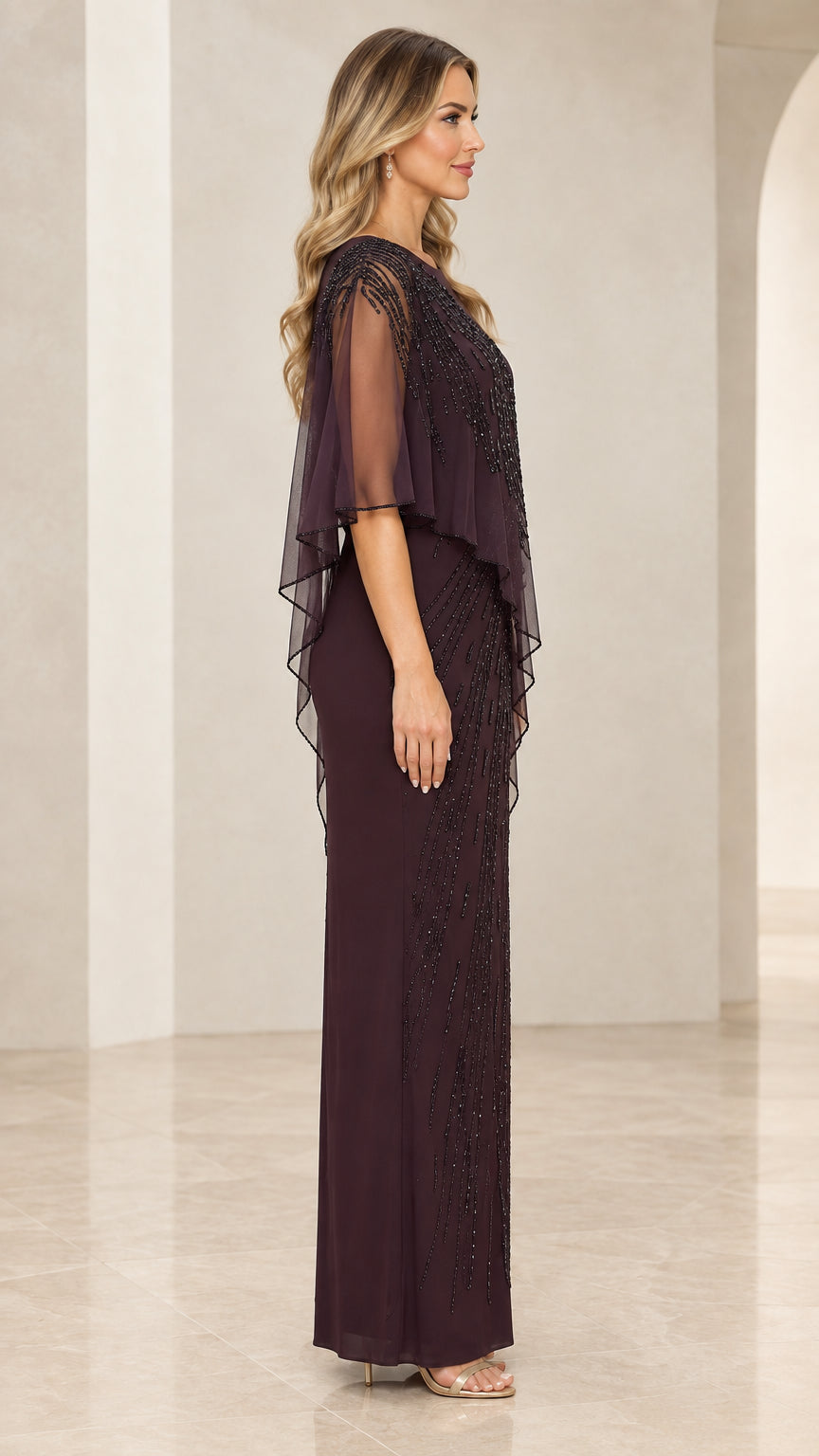 Side angle of model wearing Plum beaded formal gown with sheer cape