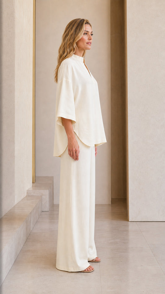 Side profile view of cream lounge set on model