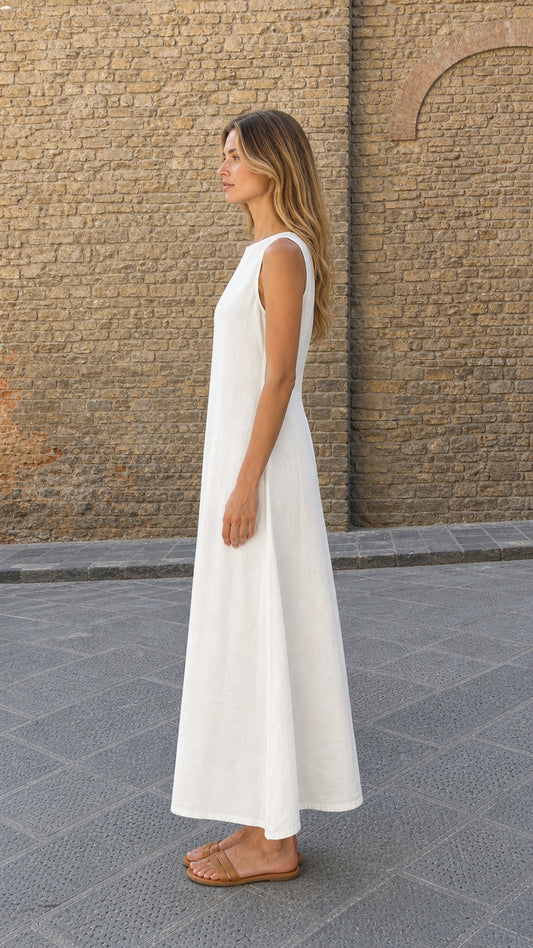 Side profile view of model wearing white linen maxi dress