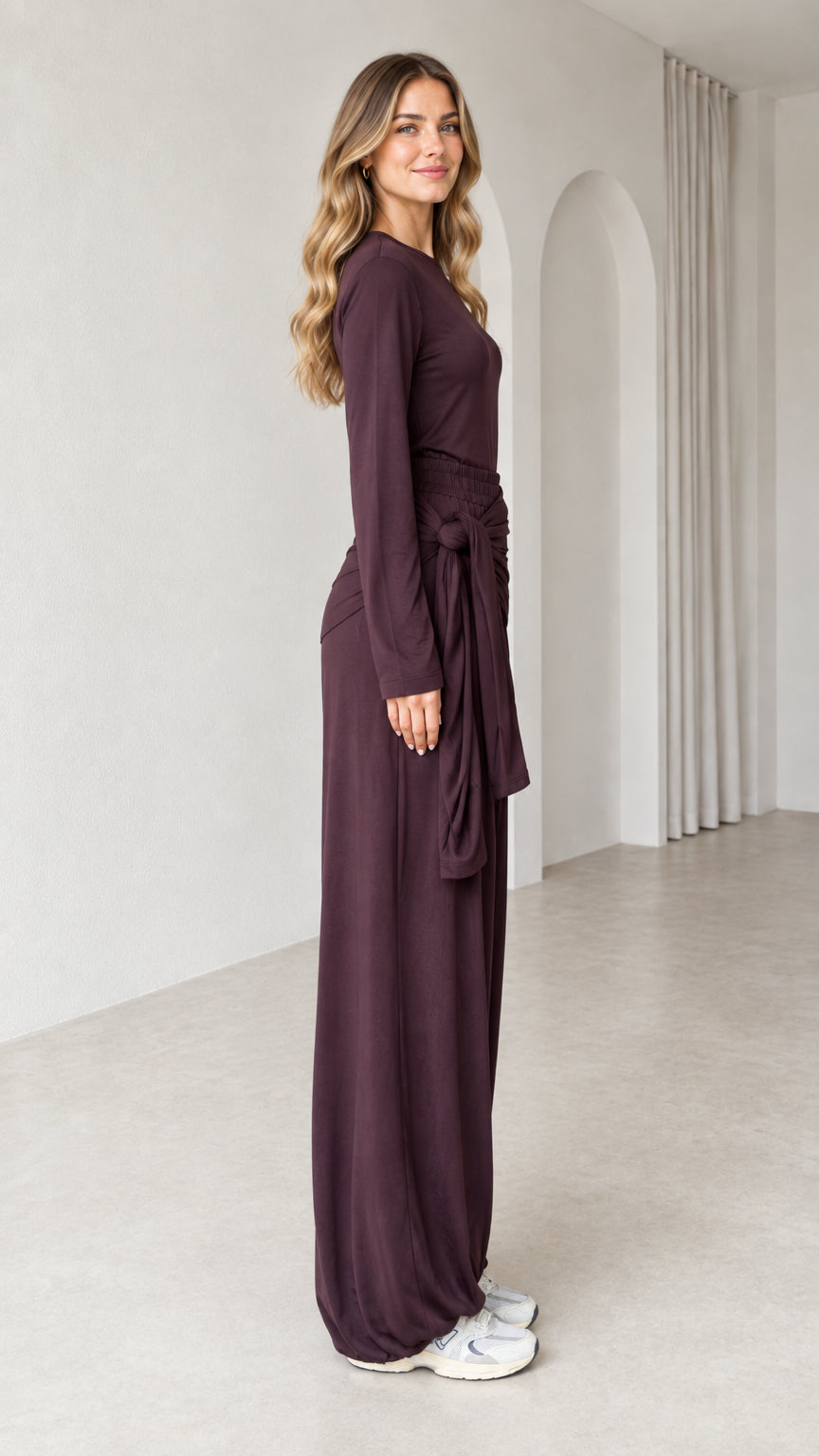Side profile of woman wearing plum matching two-piece lounge set