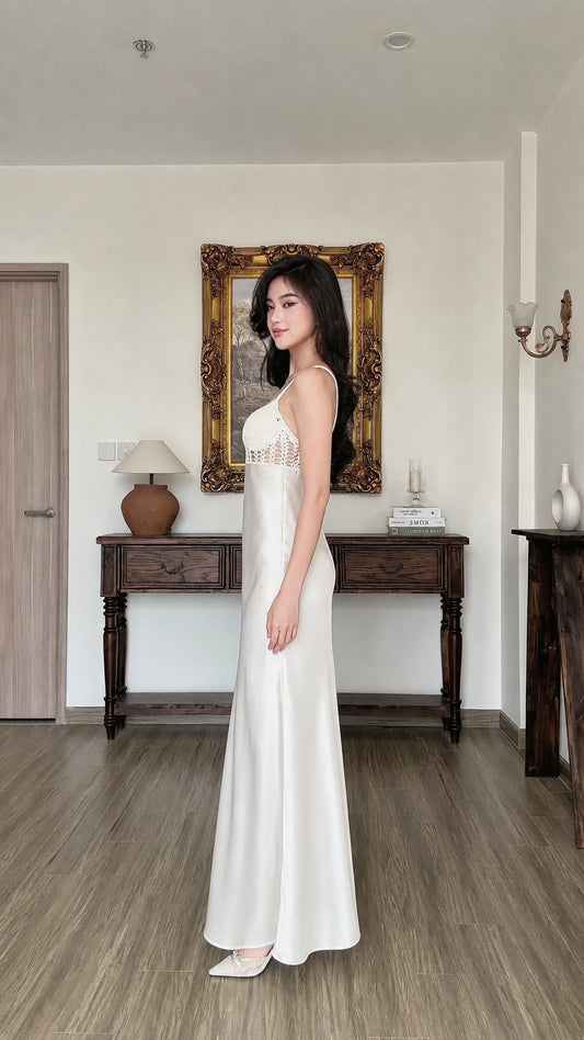 Side profile view of white satin slip dress