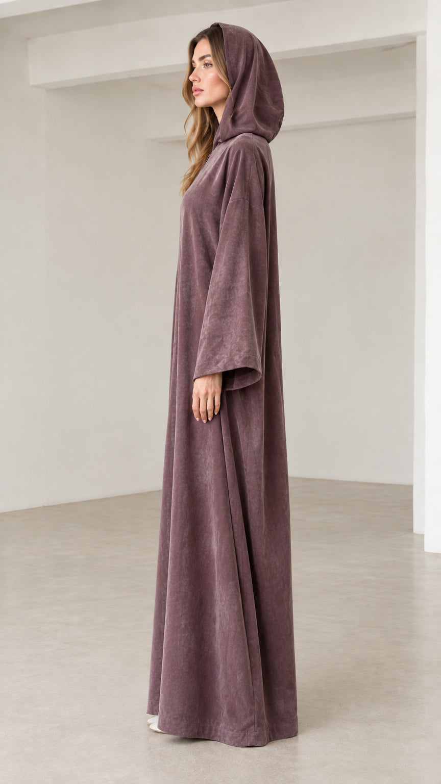 Side profile of women's dusty mauve hooded long sleeve abaya dress