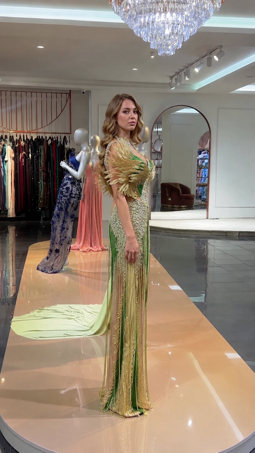 Side profile of emerald green beaded mermaid formal dress