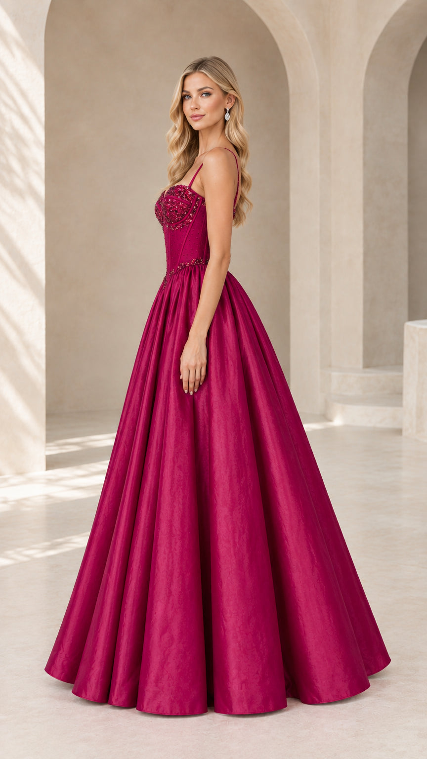Side profile of model in magenta floor-length sweetheart evening dress