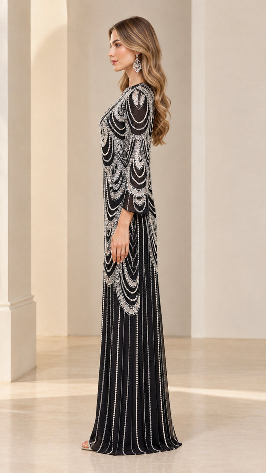 Side profile view of black beaded maxi gown showcasing flared sleeves and column drape