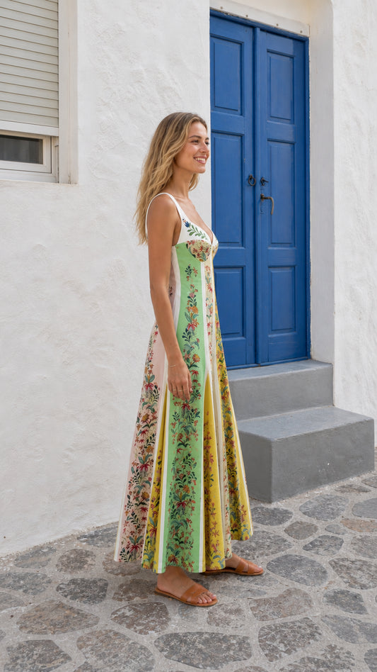 Side profile of woman in multi-color floral panel maxi dress