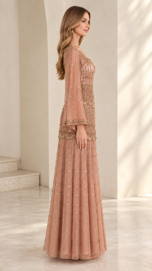 Side view of dusty rose embellished floor-length formal dress with sheer sleeves