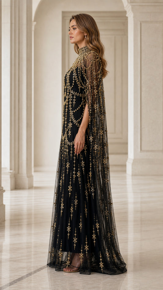 Side profile view of model in black beaded evening gown