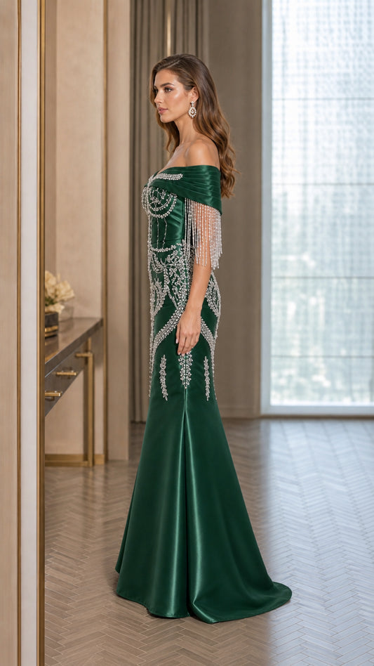 Side profile of emerald green embellished satin evening dress