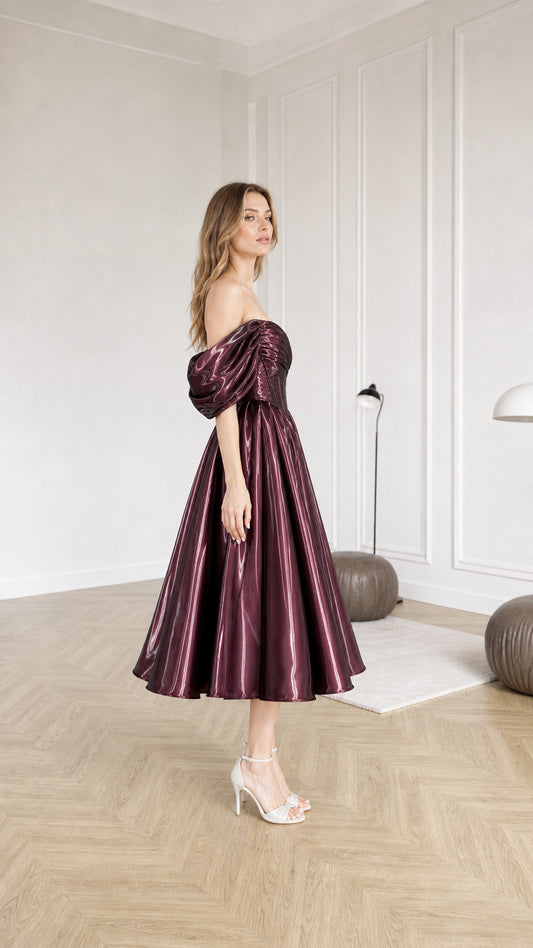 Side profile view of burgundy metallic midi dress