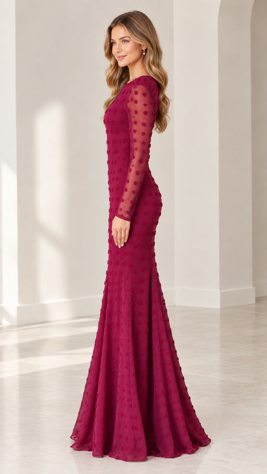 Side profile view of burgundy textured dot floor-length formal dress