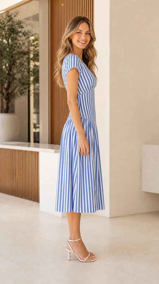 Side view of woman wearing blue striped midi dress
