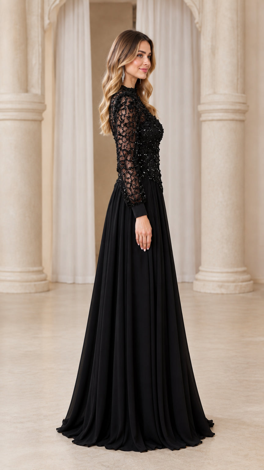 Side profile of woman in black mock neck long sleeve lace evening dress with flowing pleated skirt