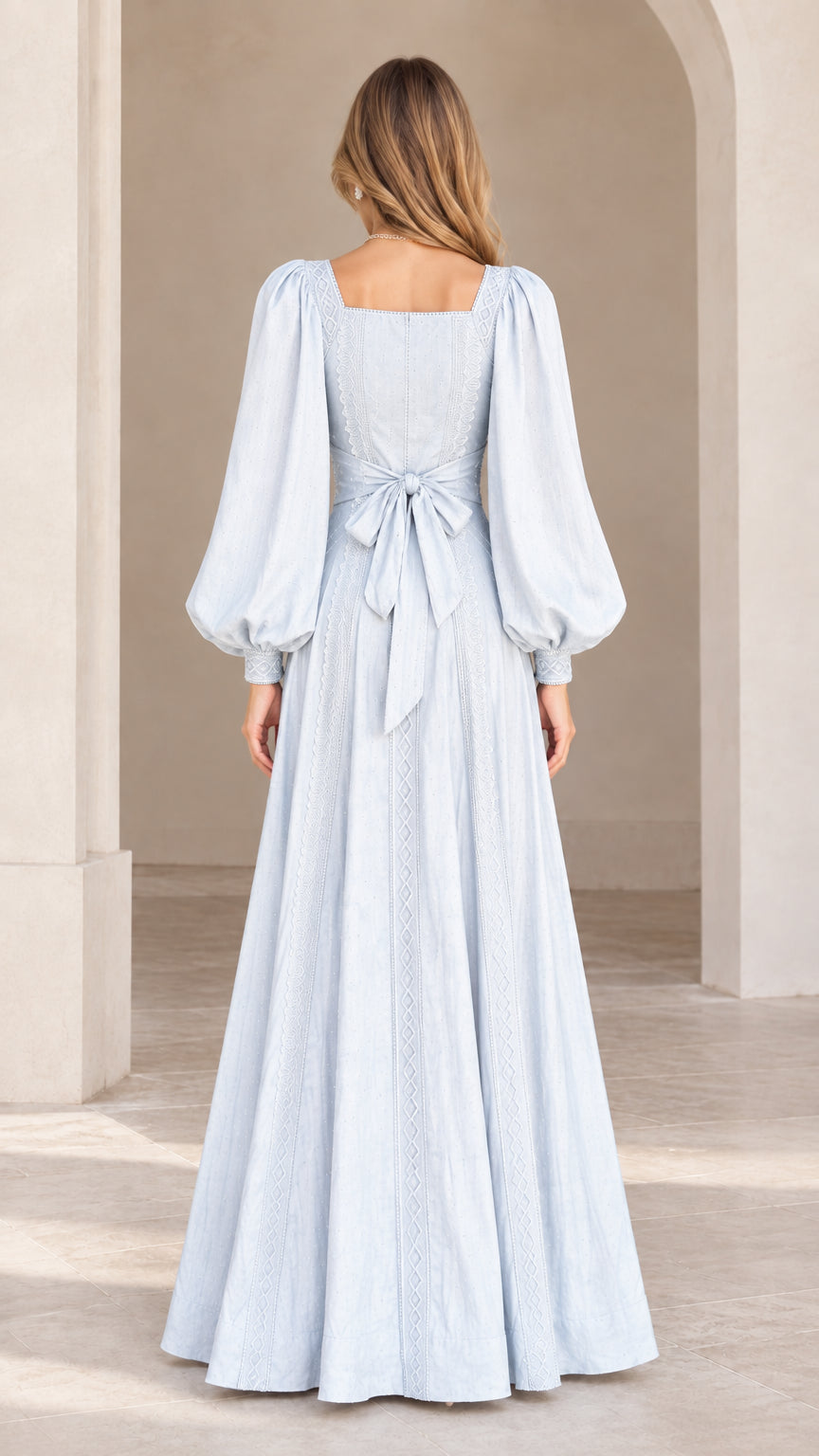 Back view of model showing the back tie sash and square back of the Light Blue maxi dress