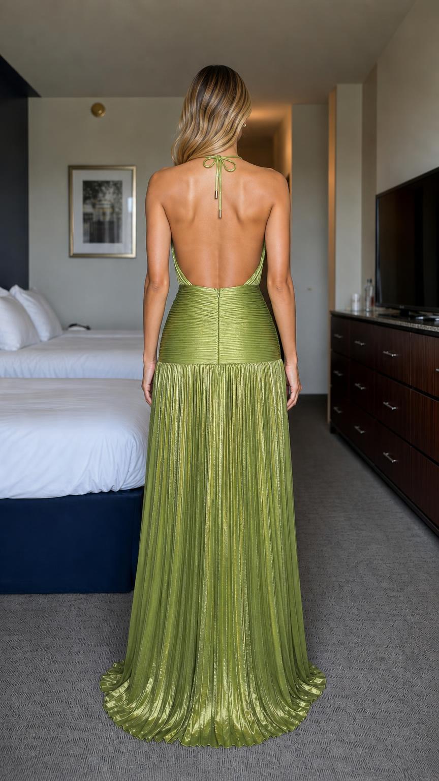 Back view of green halter pleated maxi dress showing open back