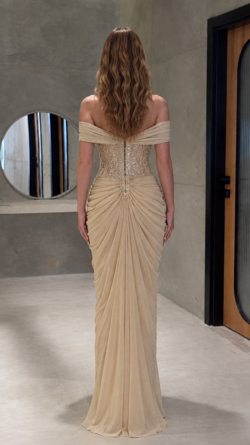 Back view of floor-length champagne formal gown with gathered detailing