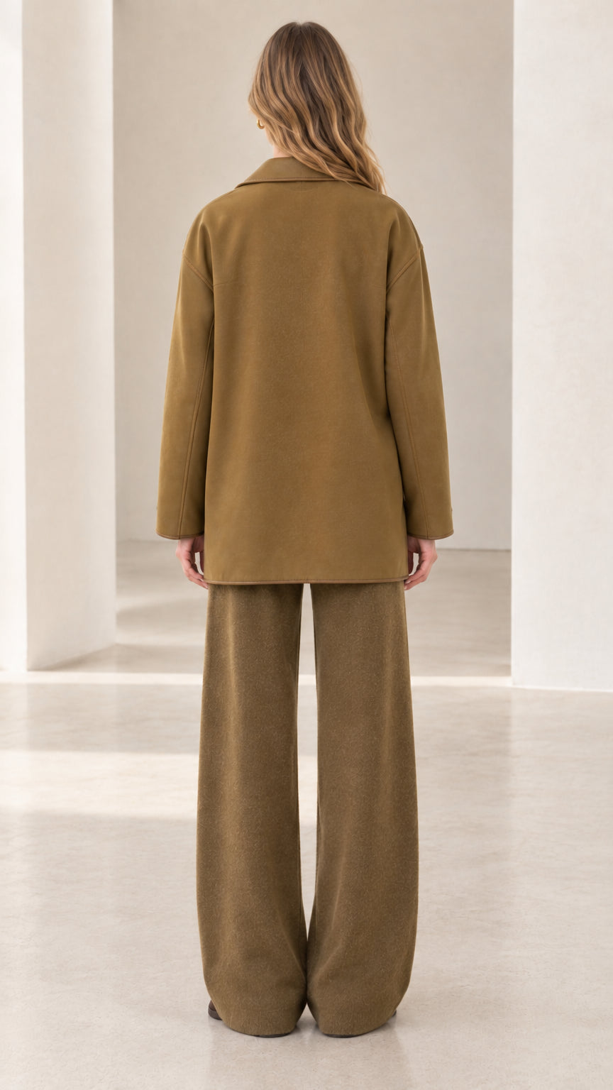 Back view of women's relaxed 3-piece jacket and wide-leg knit pants in camel brown