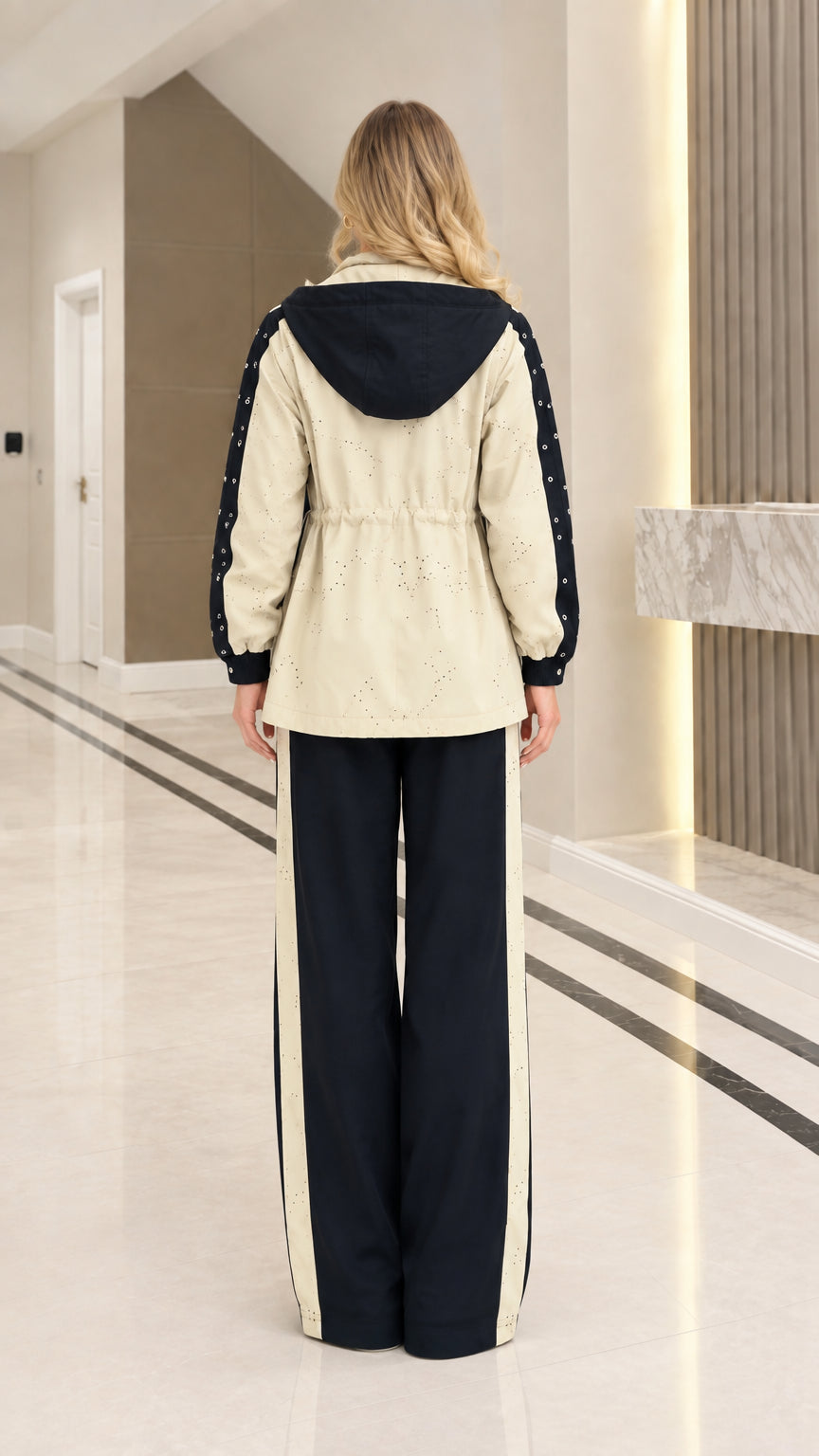 Back view of woman wearing Black colorblock hooded tracksuit set