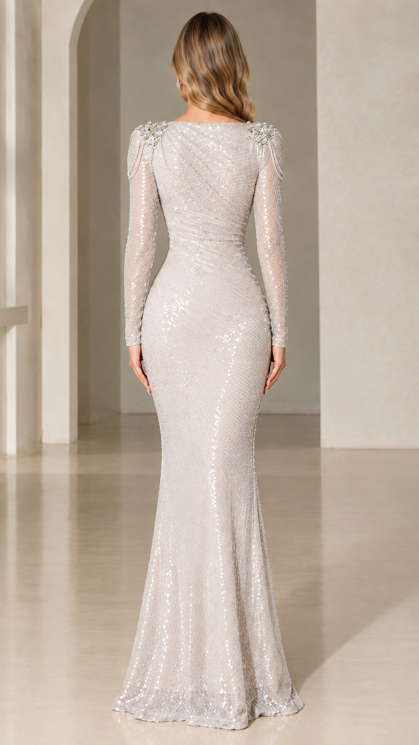 Back view of silver sequin mermaid evening gown showing fitted silhouette