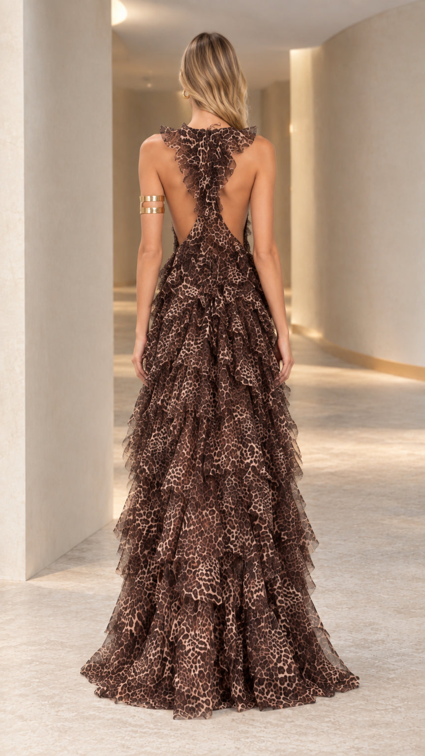 Back view of model in Classic Brown leopard print maxi gown highlighting dramatic low back and ruffled strap