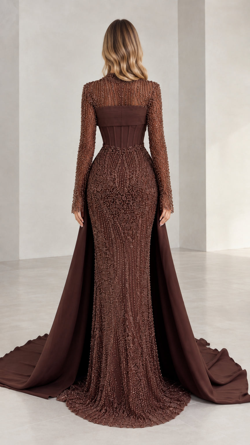 Back view of brown beaded evening gown showing sleek silhouette and attached dramatic train
