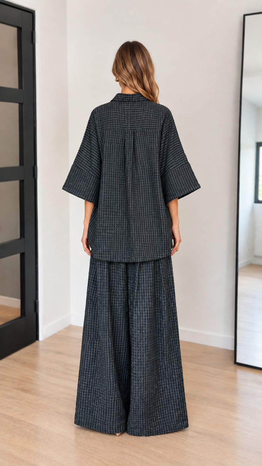 Back view of model wearing charcoal wide-leg matching co-ord set