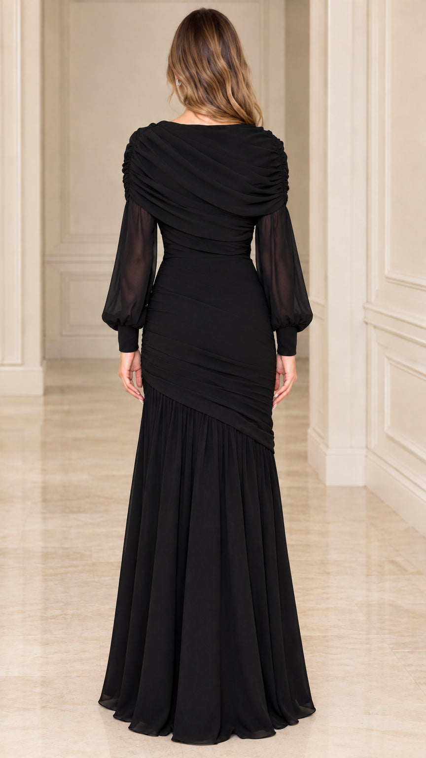Back view of model wearing black draped cowl neck floor-length gown