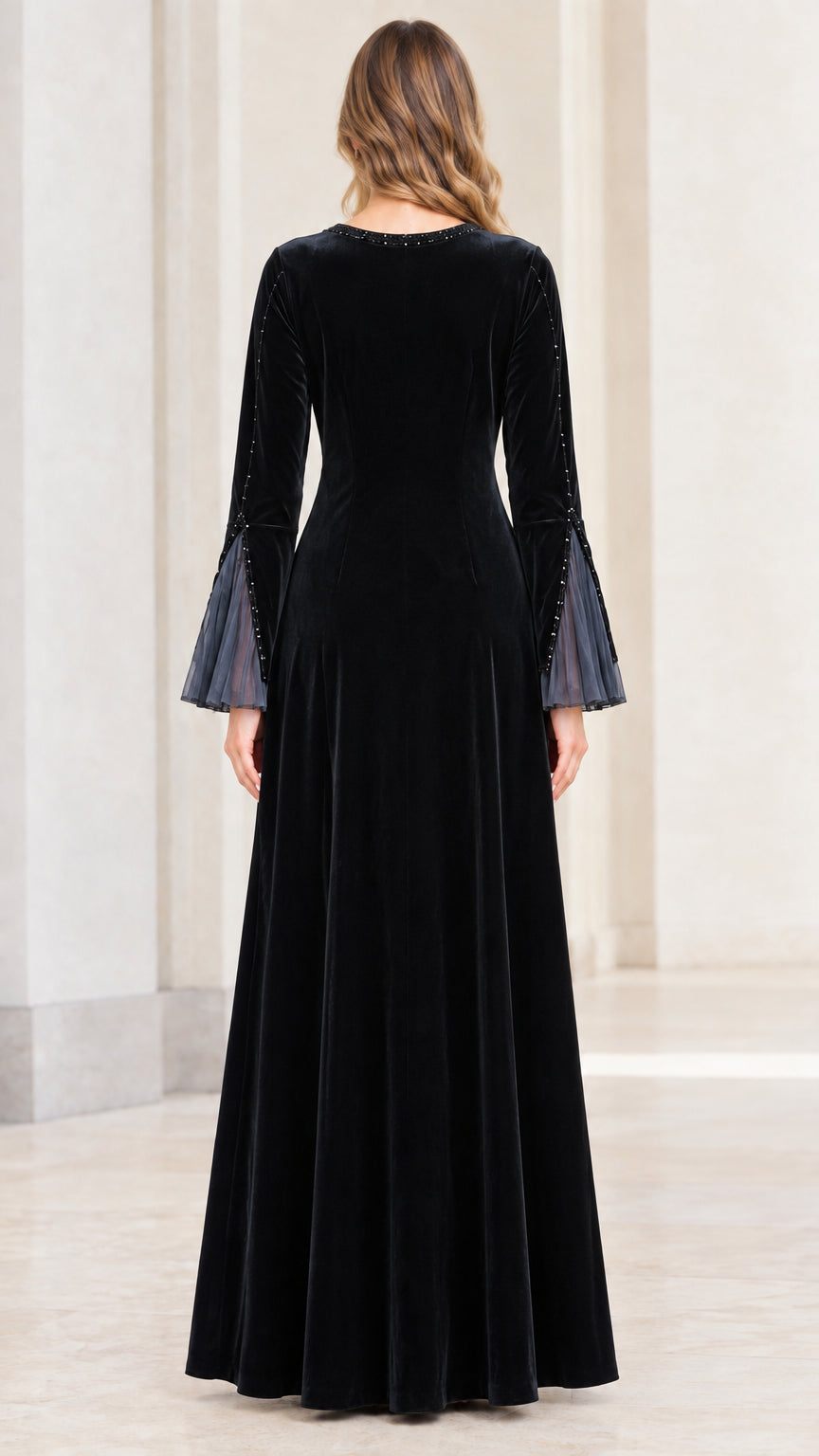 Full back view of black velvet A-line long sleeve maxi dress