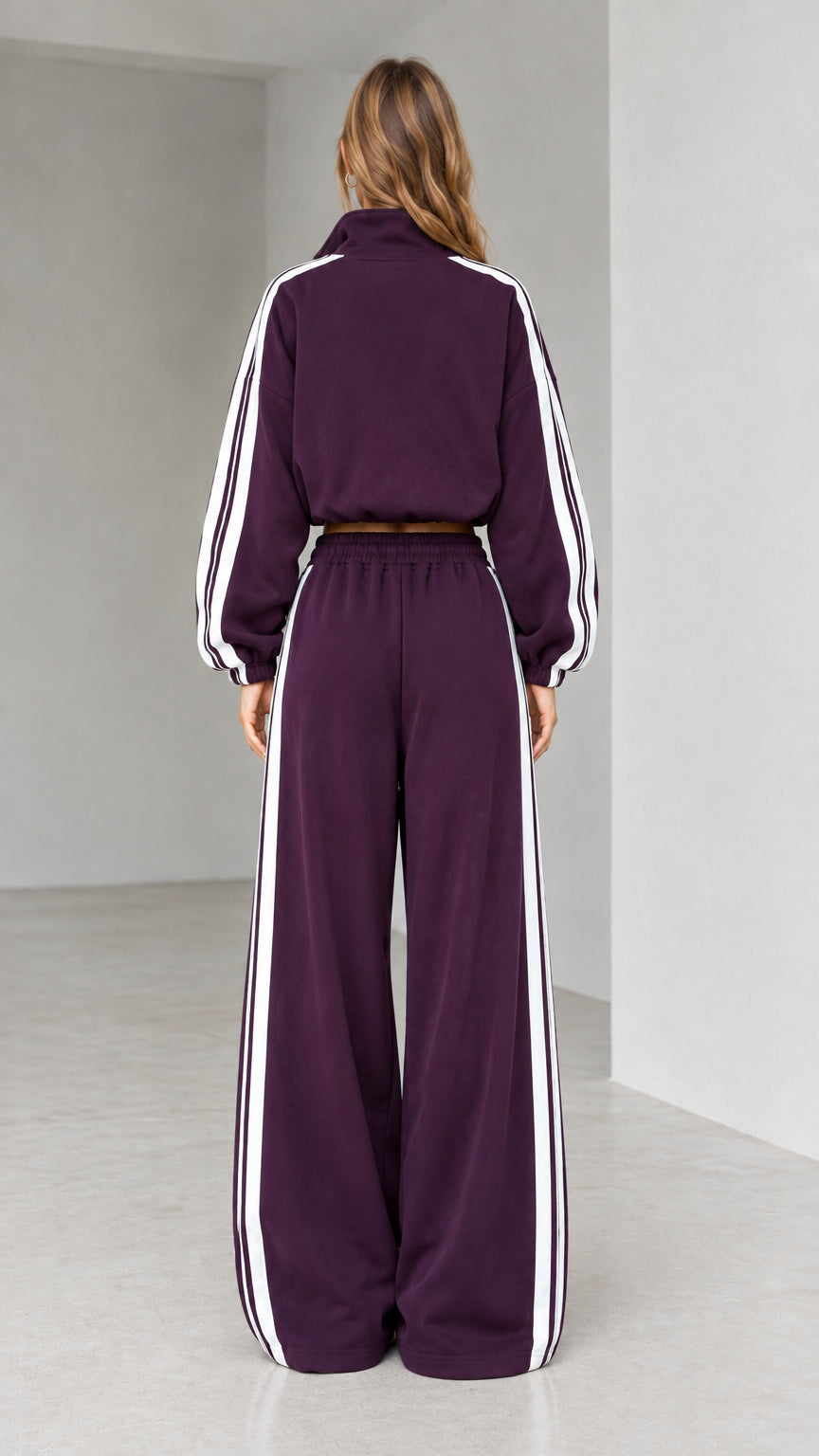 Back view of woman wearing deep plum sporty tracksuit set