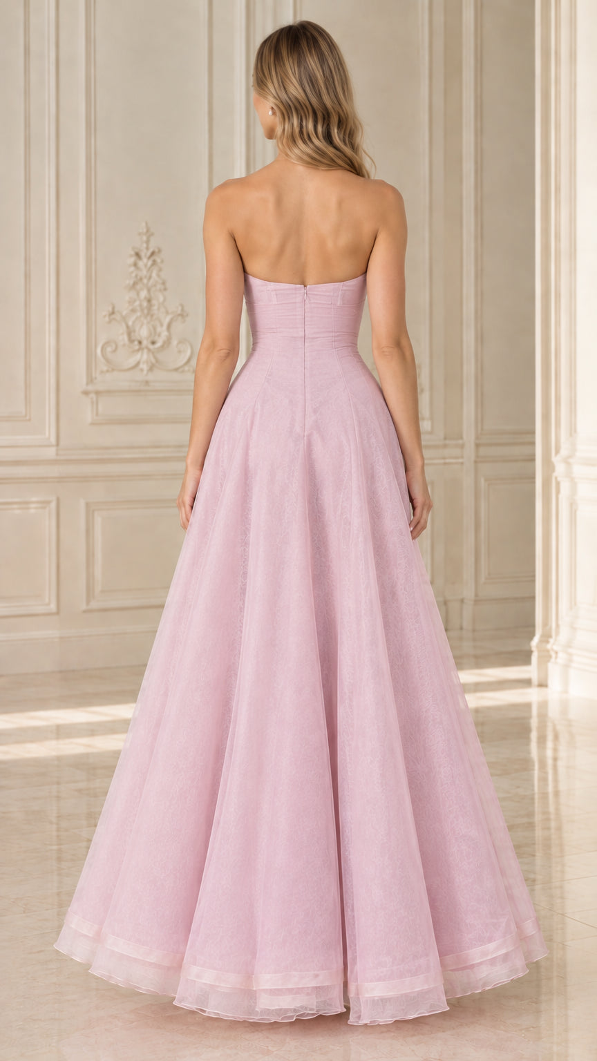 Back view of model in Blush Pink strapless floor-length formal dress