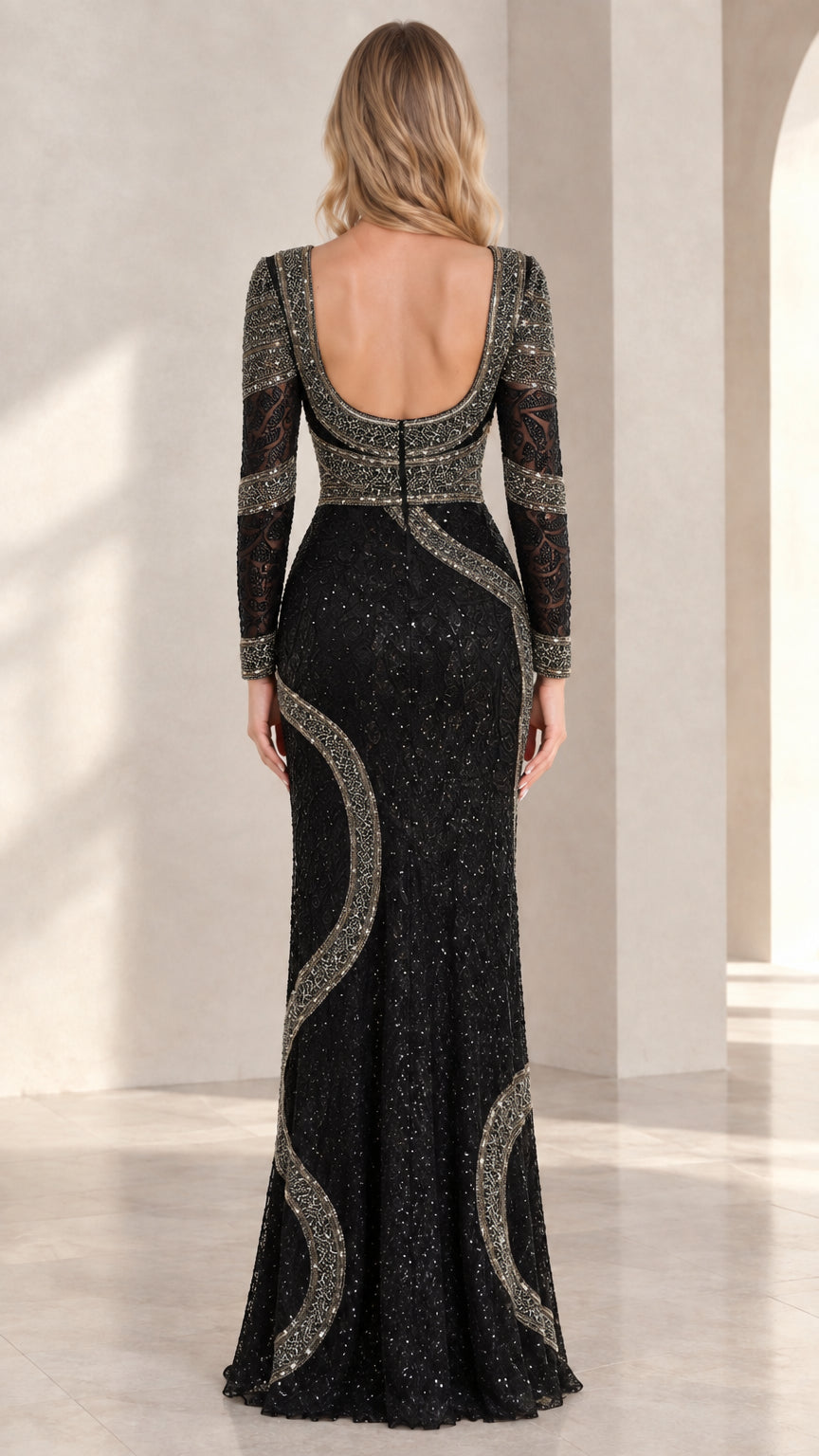 Back view of black long-sleeve evening gown showing low scoop back