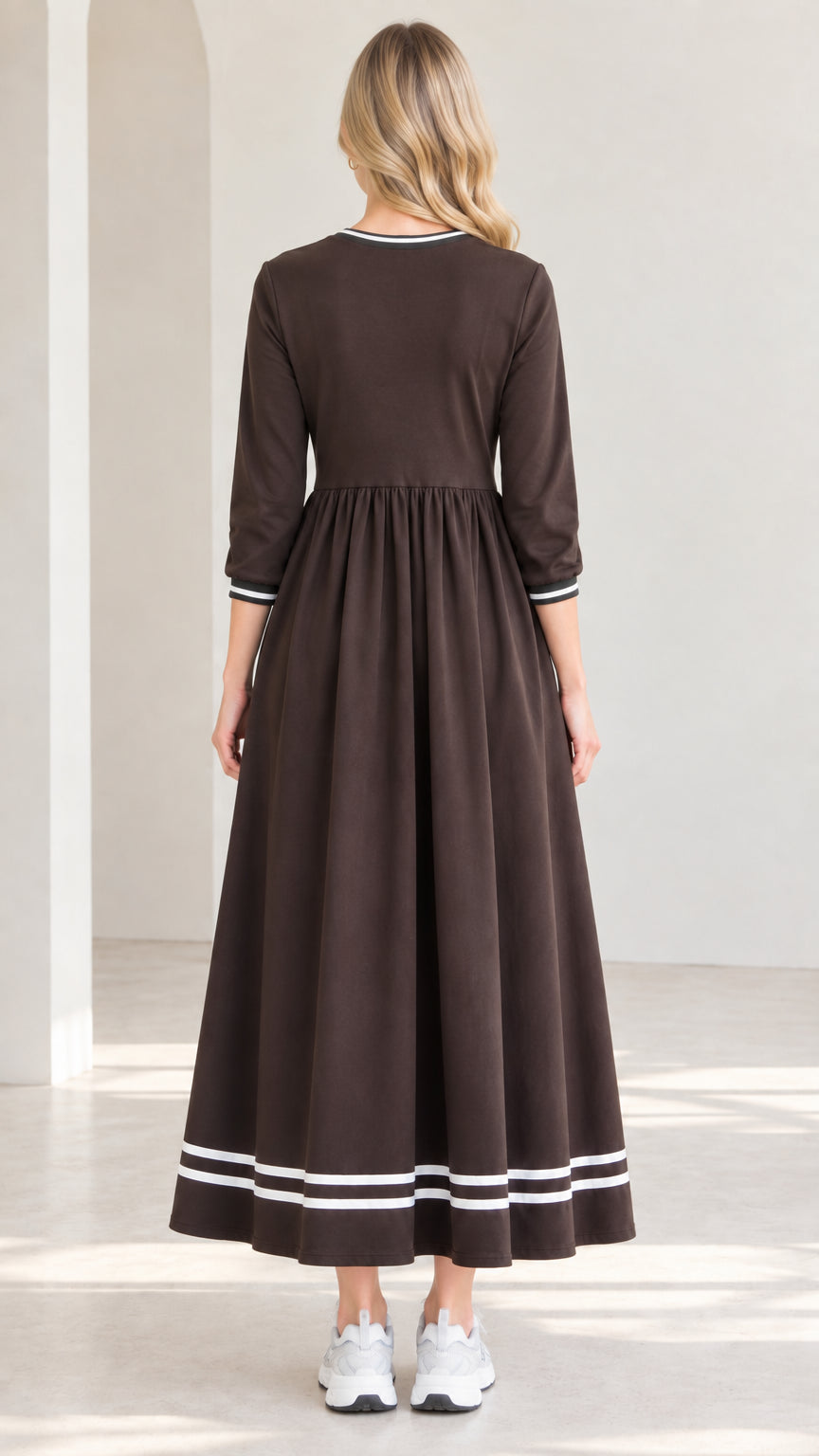Back view of woman wearing brown 3/4 sleeve swing maxi dress