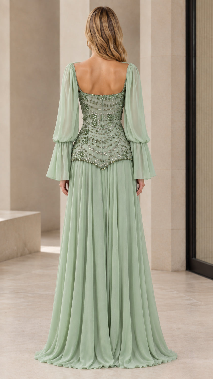 Back view of woman wearing sage green floor-length chiffon evening dress with scoop back