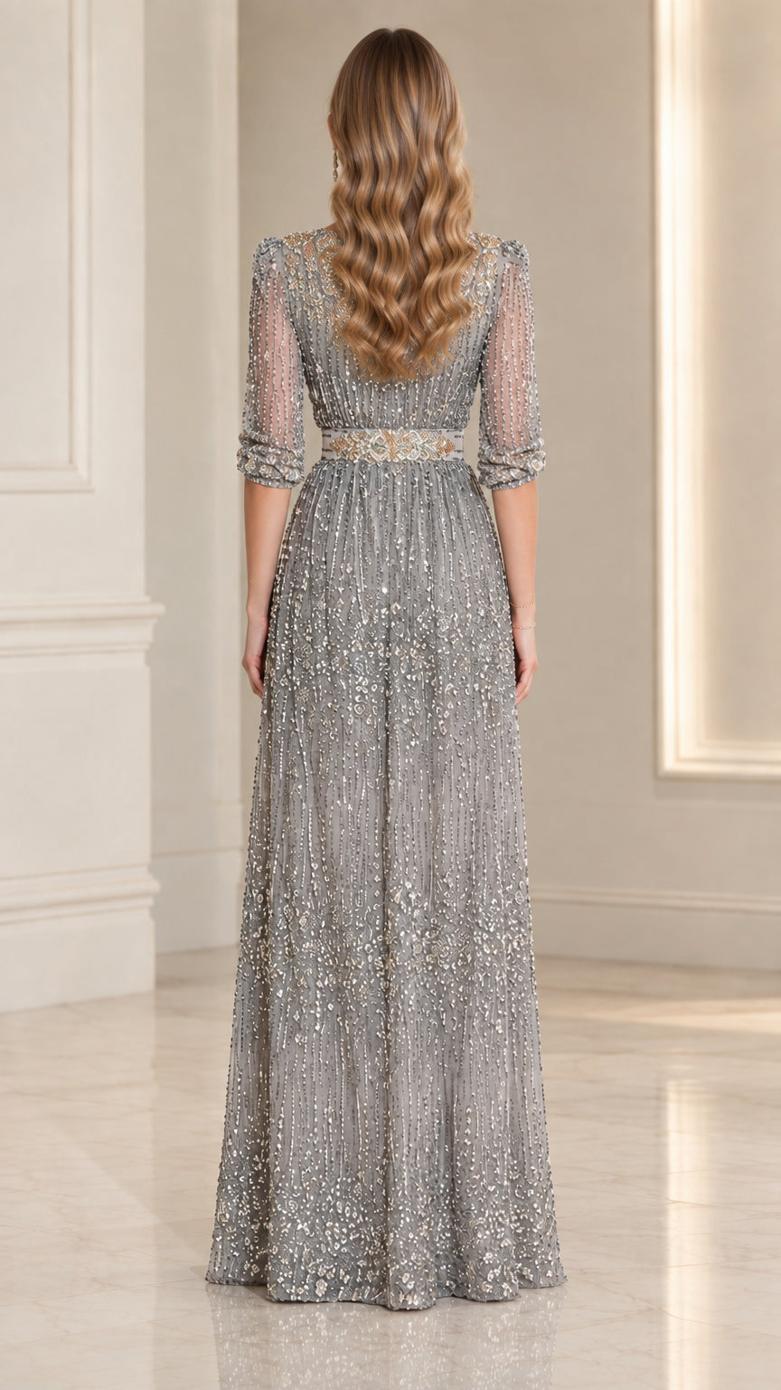 Back full view of silver floor-length embellished evening dress