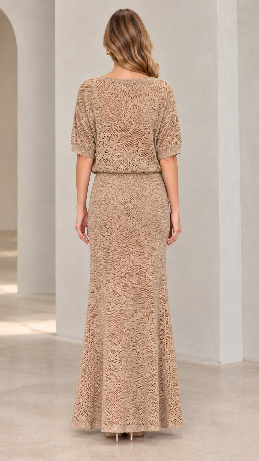 Back view of woman wearing beige textured knit blouson maxi dress