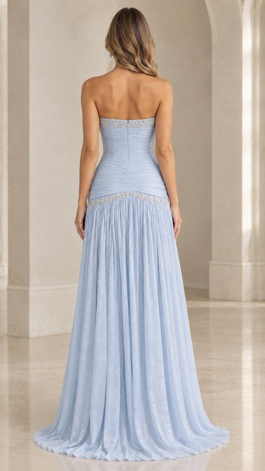 Back view of light blue strapless ruched evening dress with beaded accents