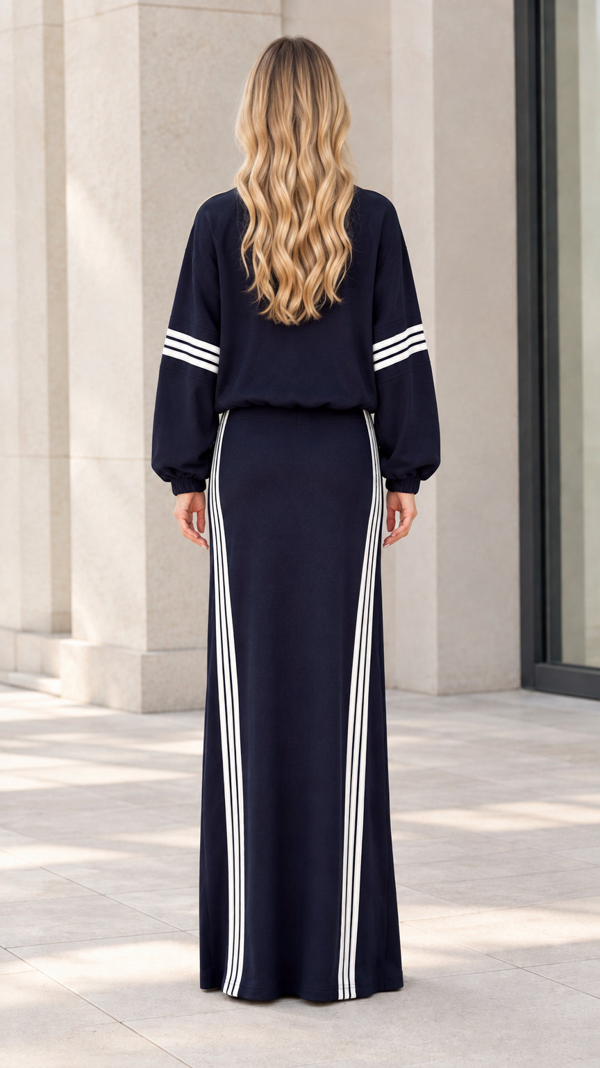 Back view of navy blue two-piece jacket and maxi skirt set