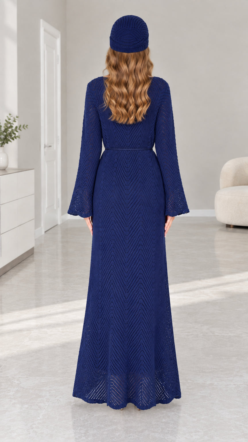 Back view of woman wearing full length Navy Blue knit dress