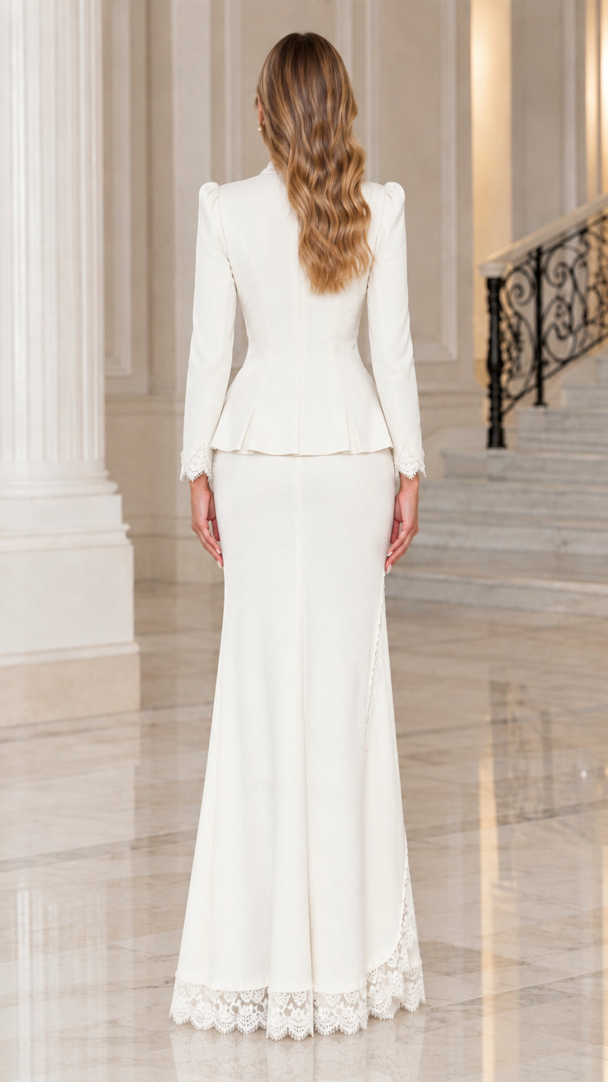 Back view of woman in ivory peplum jacket and floor-length lace-trimmed skirt