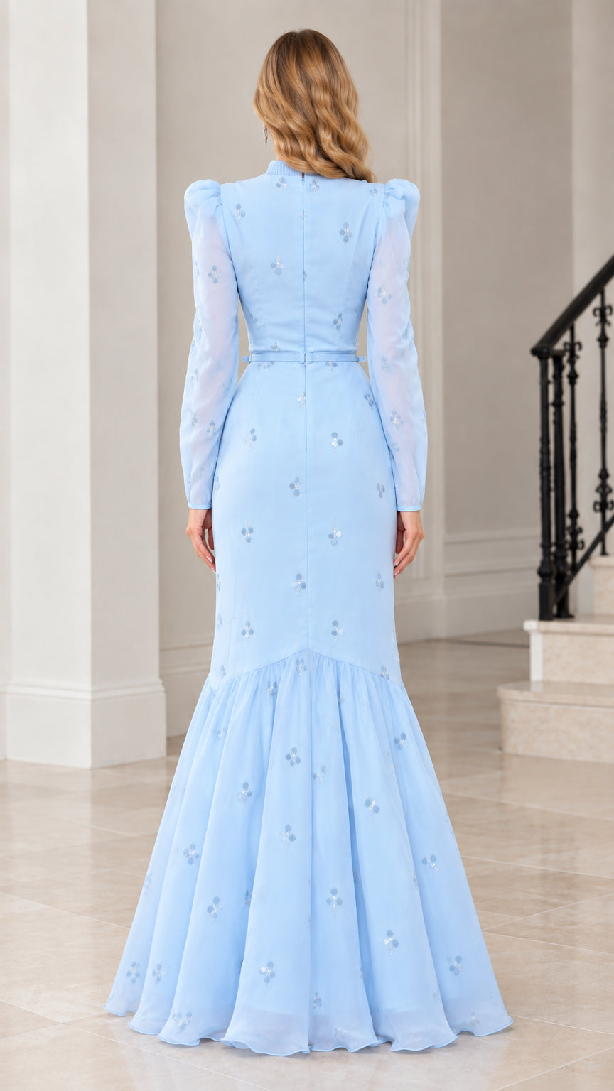 Back view of light blue mermaid evening dress showing back zipper and fluted hem