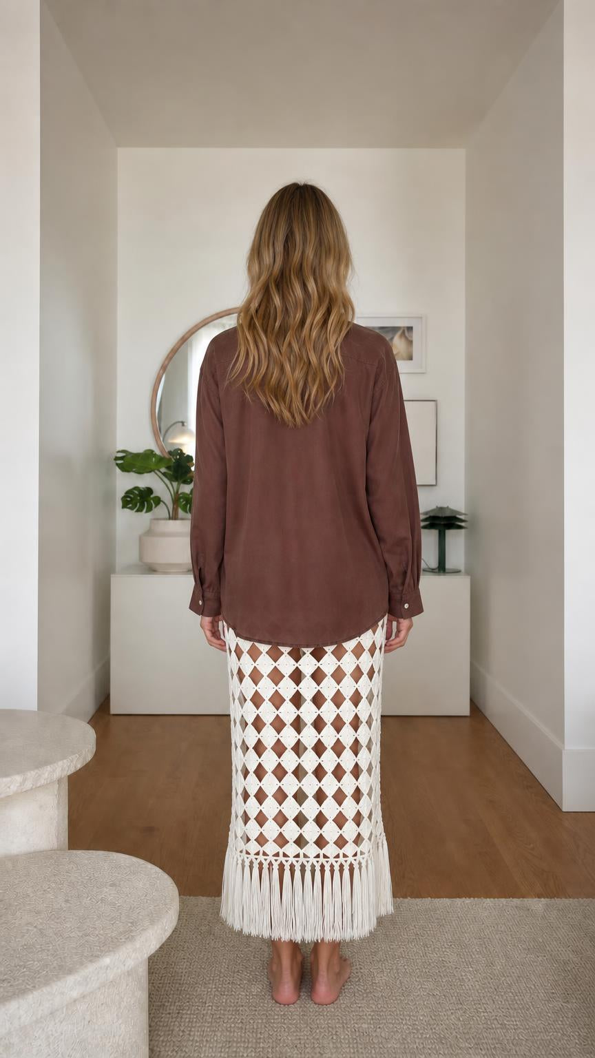 Model wearing brown long sleeve button-down shirt, back view