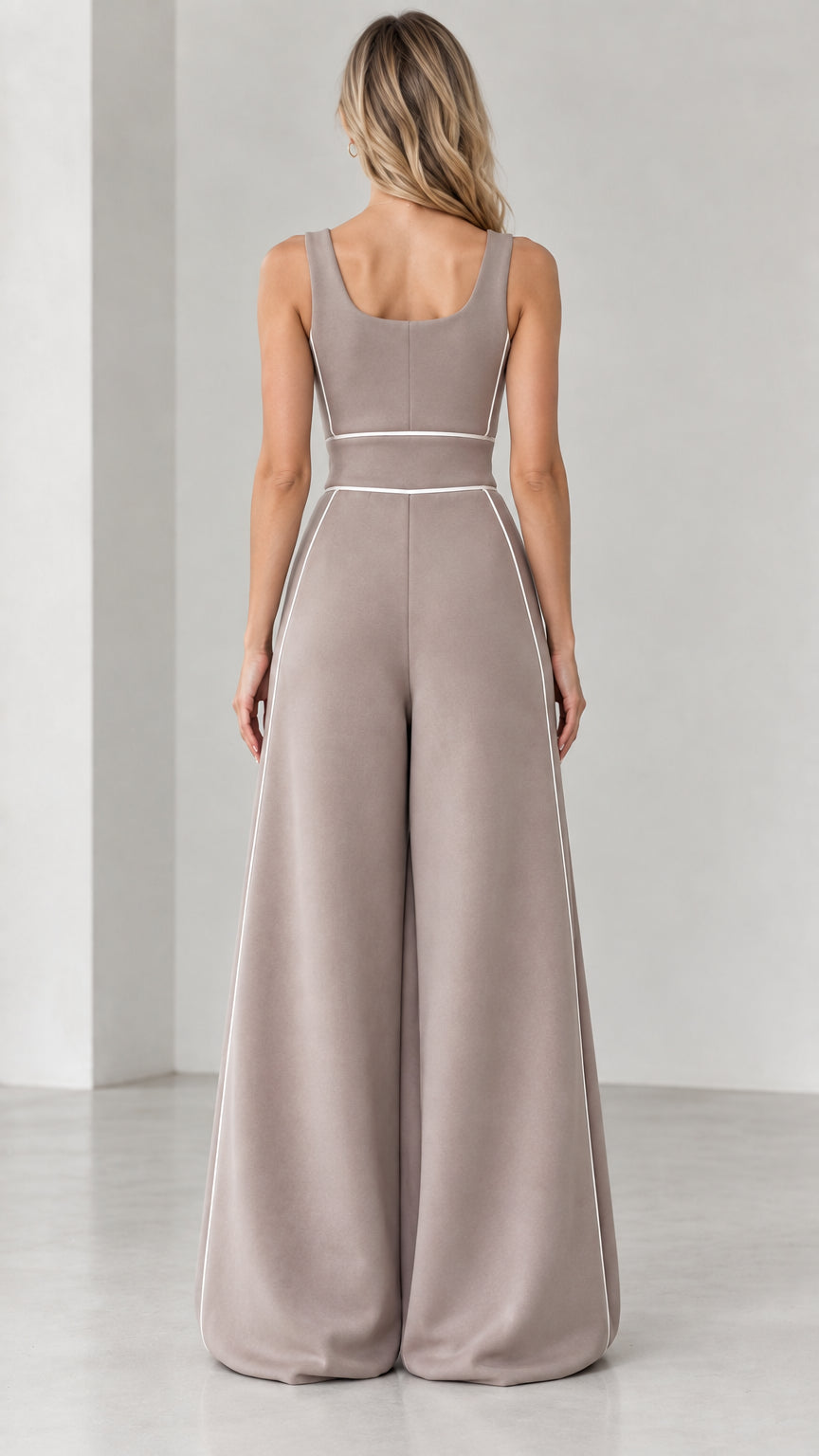 Back view of taupe scoop neck wide-leg jumpsuit showing back piping detail