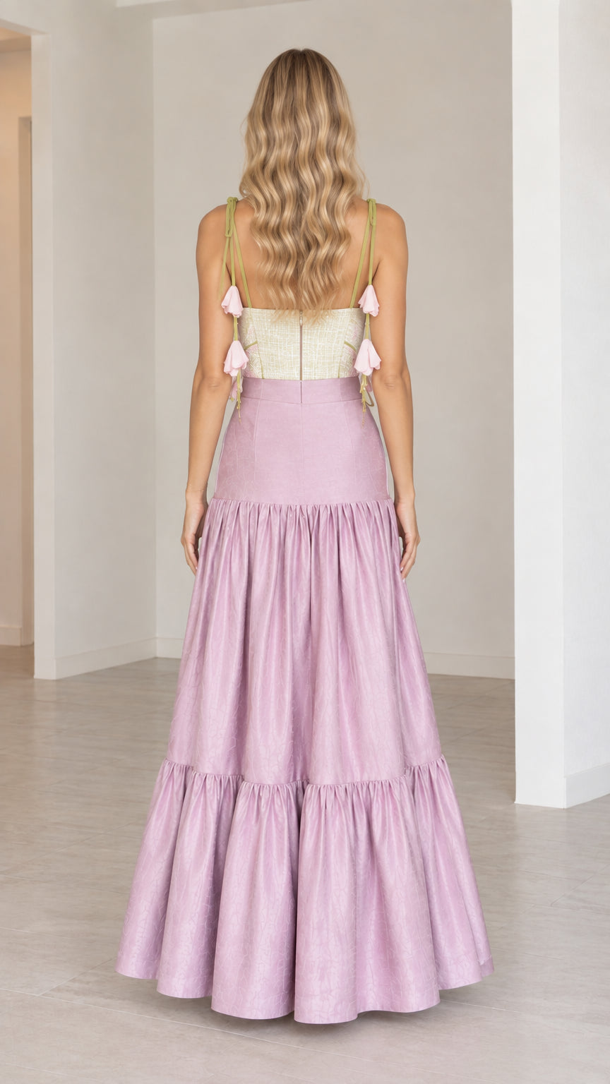Back view of lilac tiered maxi skirt and corset top with shoulder tie accents