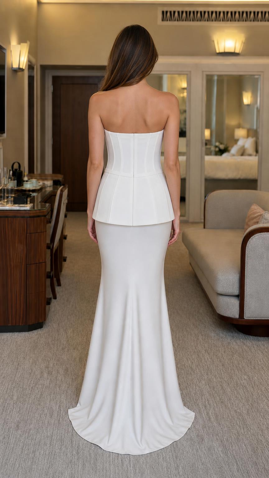 Back view of white strapless evening gown with slight train
