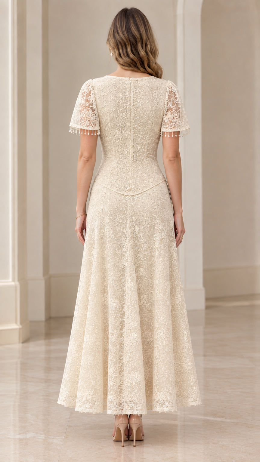Back view of woman wearing champagne lace maxi dress with concealed zipper