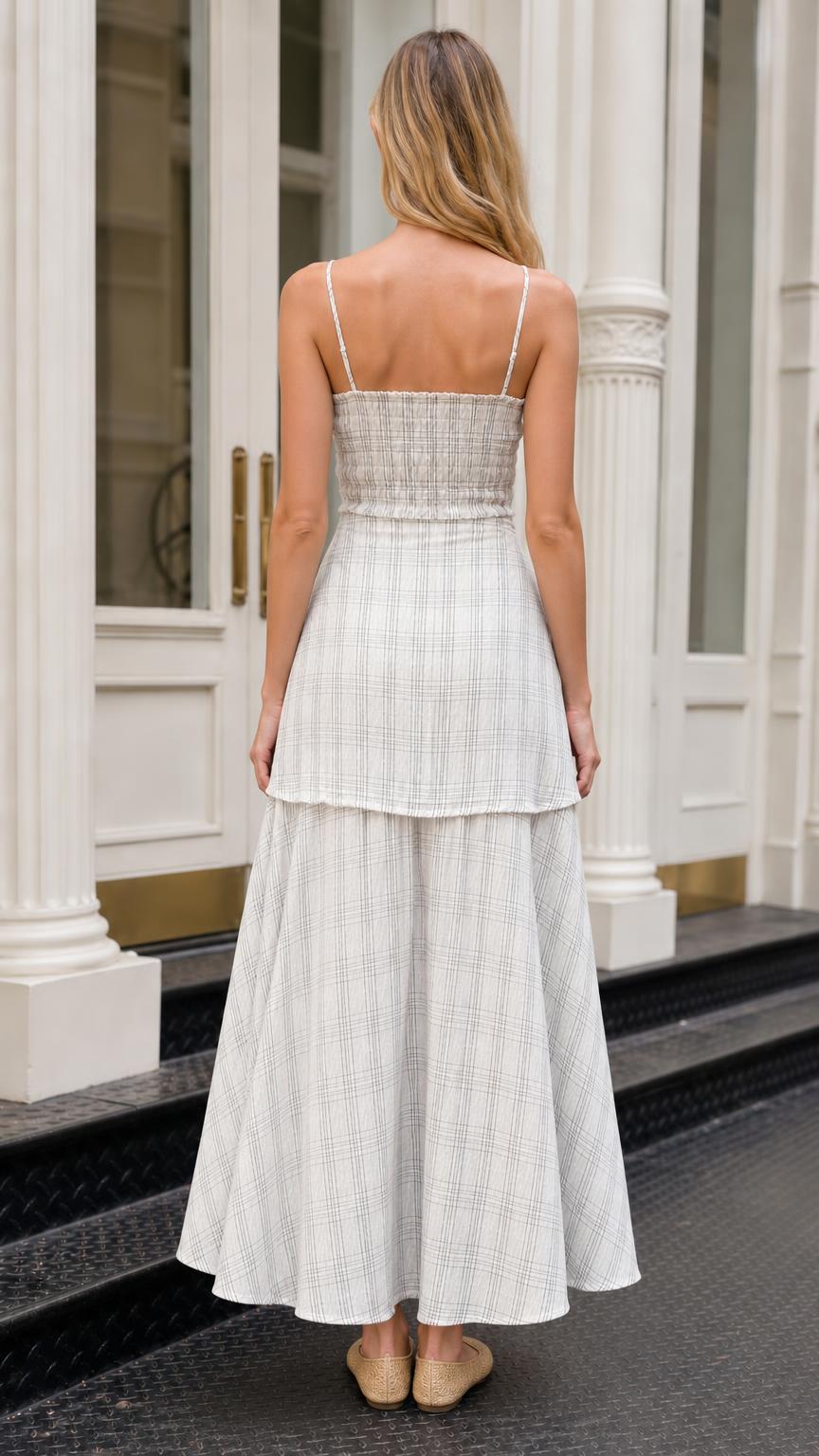 Back view of model wearing white plaid tiered maxi dress