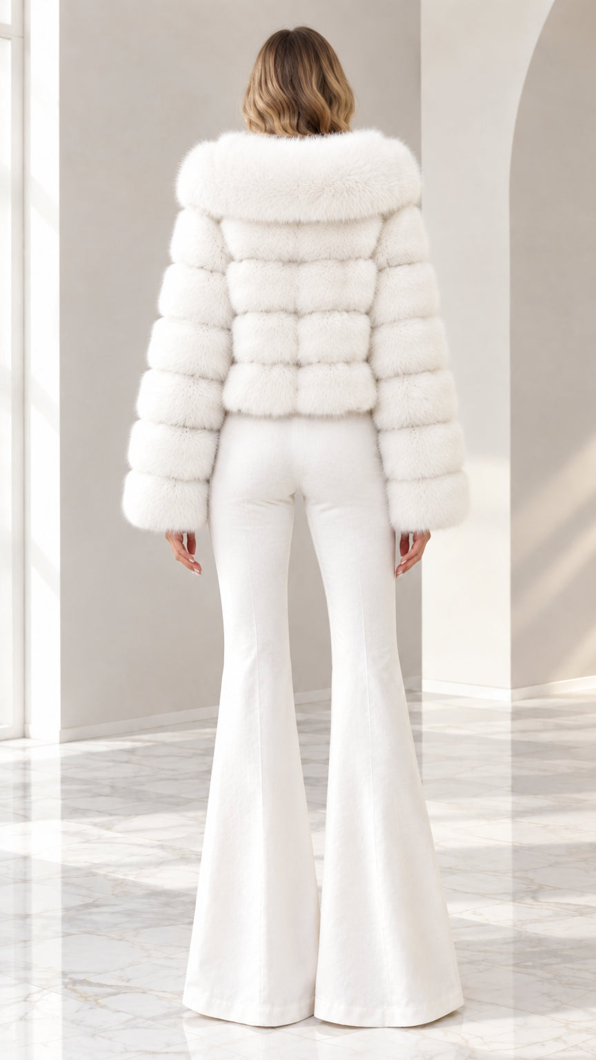 Back view of model wearing white plush hooded cropped fur coat